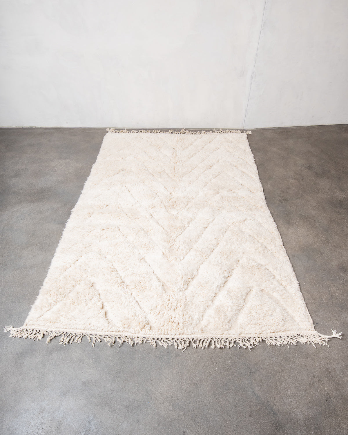 Modern, designer, handcrafted Berber rug from Morocco. Beniourain carpet with beautiful colours and patterns and fluffy wool texture.